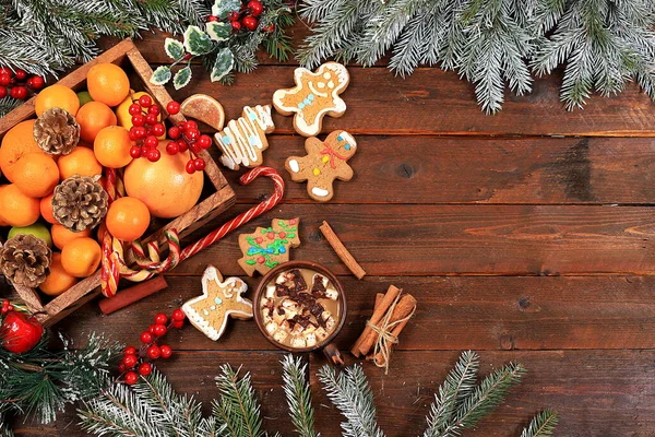 Christmas new year food, traditional festive gingerbread and tangerines with fir branches, pine cones and decorations, dish design idea, background, bakery concept