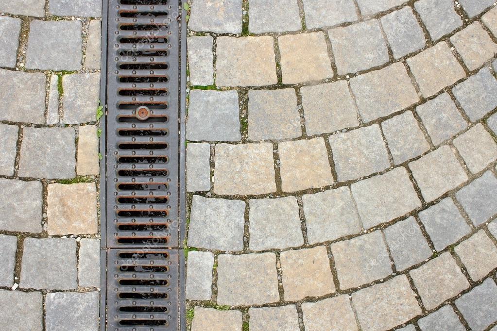 Drainage on stone paved street — Stock Photo © taviphoto 58162991
