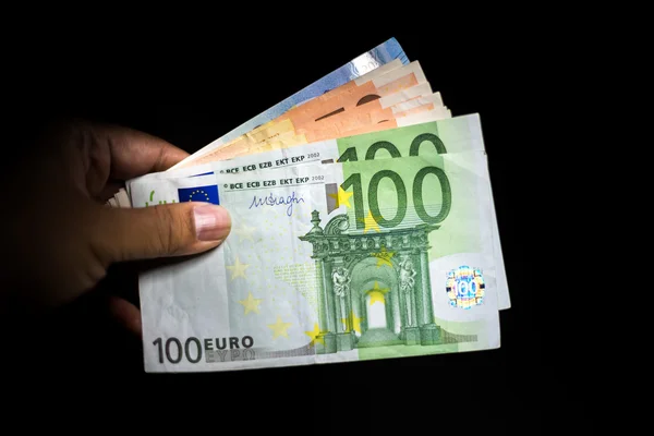 Banconote in euro in possesso di mano maschile — Foto Stock