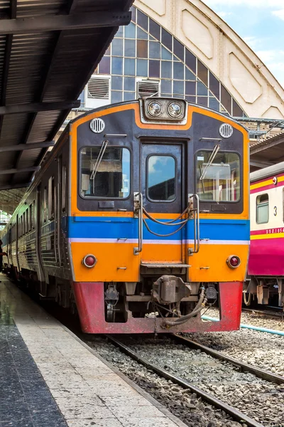 Train by the railway station — Stock Photo, Image