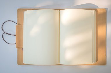 Blank Notebook on a White Paper Background