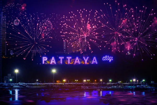 Colorful fireworks on Pattaya city alphabet in the night scene