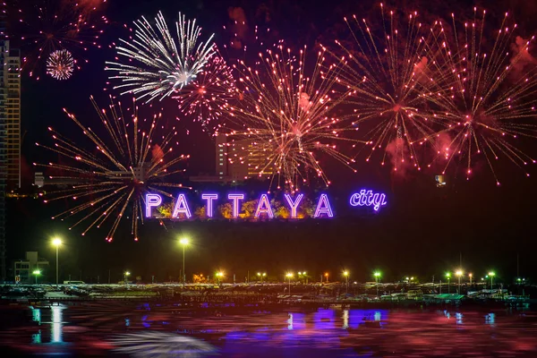 Colorful fireworks on Pattaya city alphabet in the night scene — Stockfoto