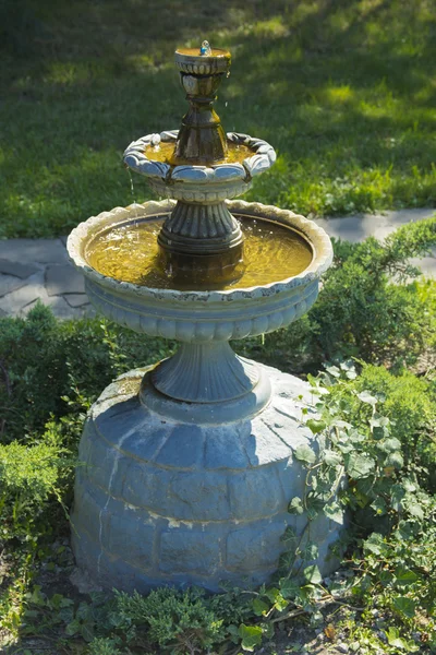 Decorative fountain in the courtyard of a private house — Stock Photo, Image