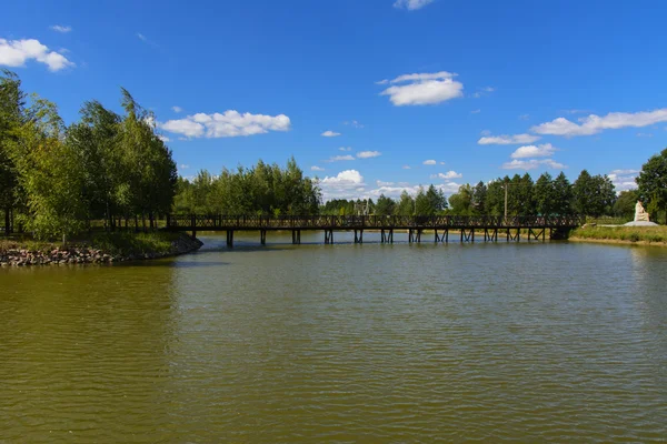 Island with a bridge on a private lake — Stock Photo, Image