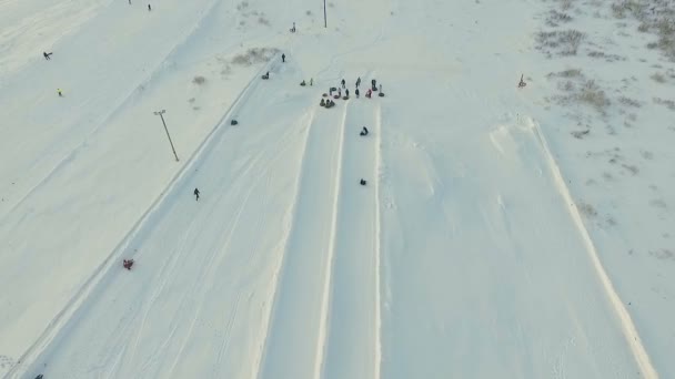 Flight above tne snow tubing track. — Stock Video
