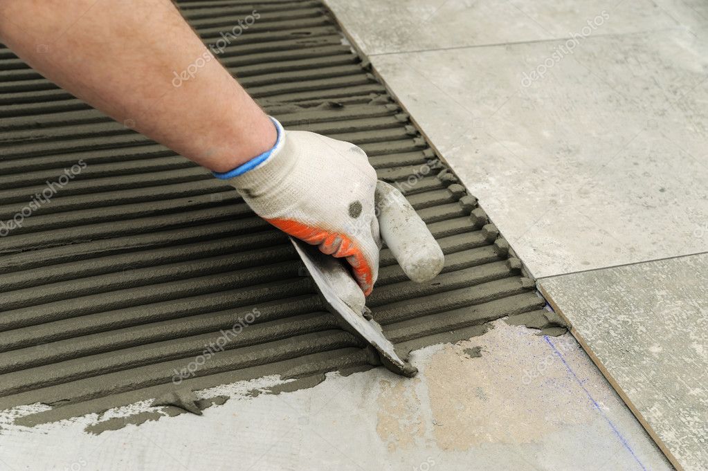 Laying Ceramic Tiles Troweling Mortar, Installing Ceramic Tile On Concrete Floor