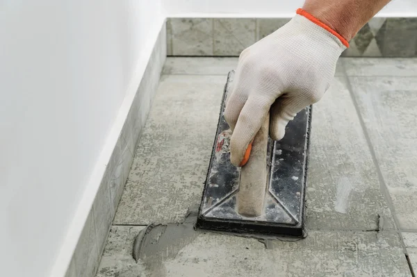 Grouting ceramic tiles. — Stock Photo, Image