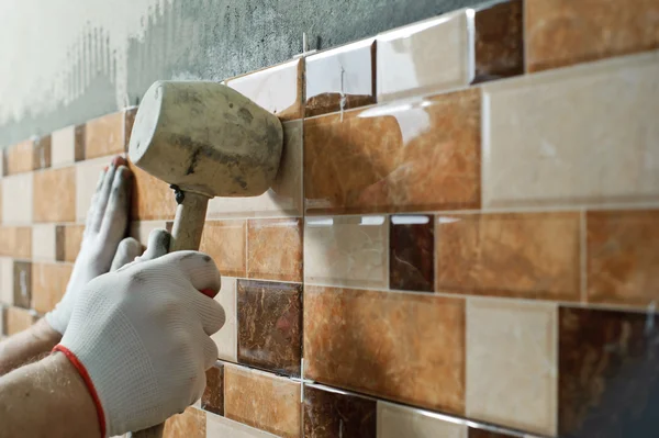 Laying Ceramic Tiles. Stock Image