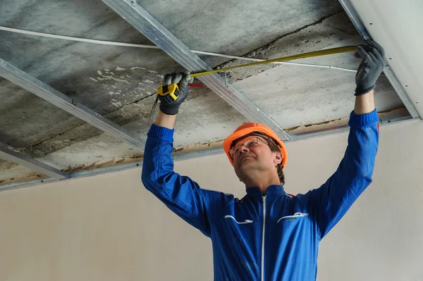 Worker Measure Metal Frame Plasterboard Ceilings — Stock Photo, Image