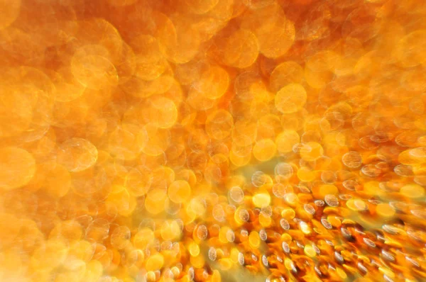 Goud en oranje lights bokeh. — Stockfoto