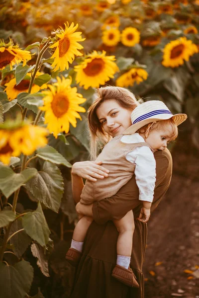Young Beautiful Mother Her Little Cute Son Walking Field Sunflowers — Fotografia de Stock