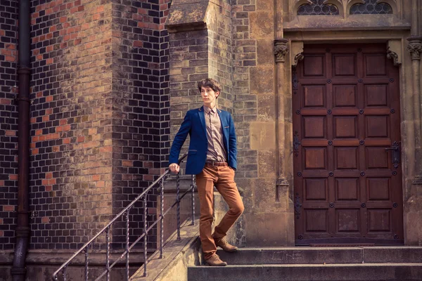 Man in beige pants and a blue blazer — Stock Photo, Image