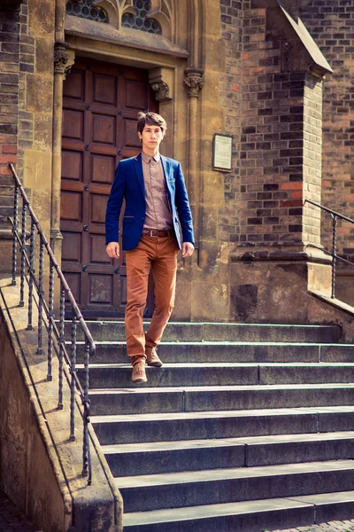 Man in beige pants and a blue blazer — Stock Photo, Image