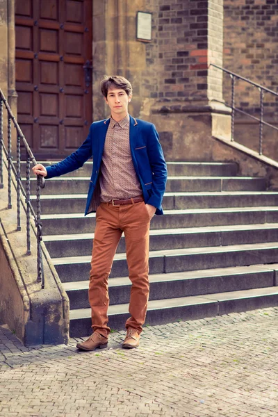 Man in beige pants and a blue blazer — Stock Photo, Image