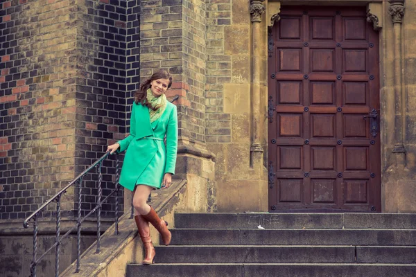 Woman in green coat — Stock Photo, Image