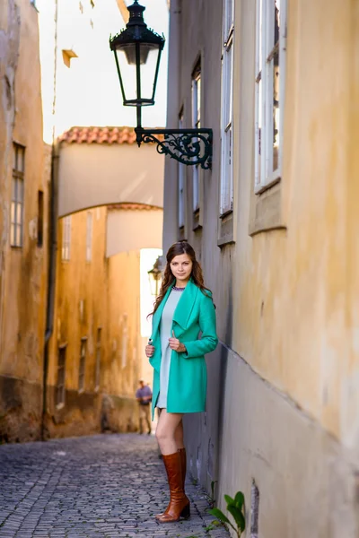Woman in green coat — Stock Photo, Image