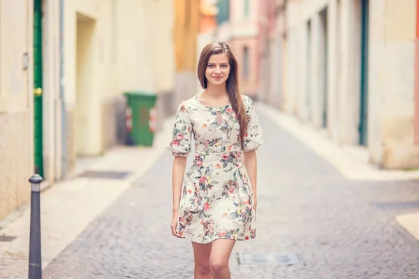 lady walking down the ancient street