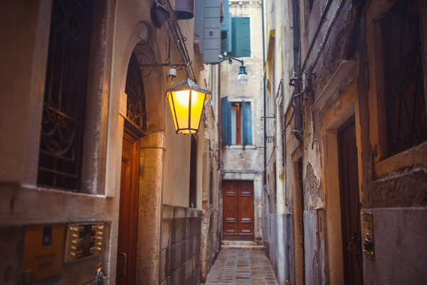Narrow old historical street in Venice, Italy