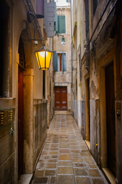 Narrow old historical street in Venice, Italy