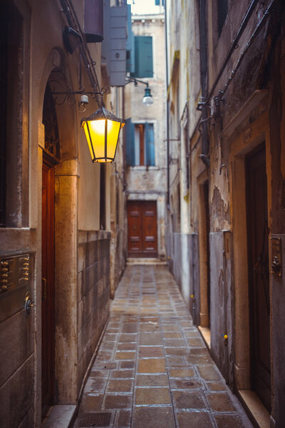 Narrow old historical street in Venice, Italy