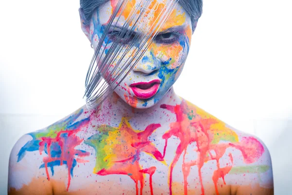 Kobieta z pomalowana twarz, tatuazy — Zdjęcie stockowe