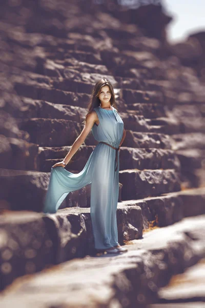 Girl on tribunes of the ancient theater — Stock Photo, Image