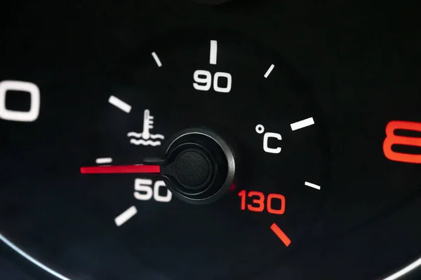 Color close up image of a car\'s coolant temperature gauge