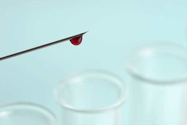 Drop Blood Tip Syringe Needle Glass Test Tubes Blue Background — Stock Photo, Image