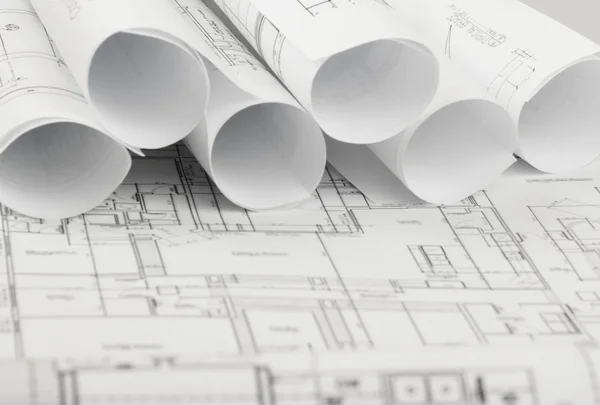 Rolls of architecture blueprints and house plans Royalty Free Stock Photos