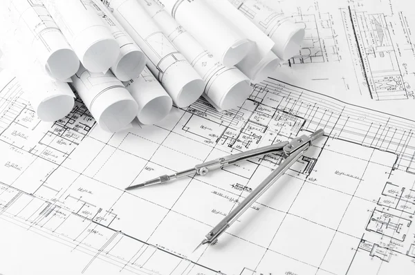 Rolls of architecture blueprints and house plans — Stock Photo, Image