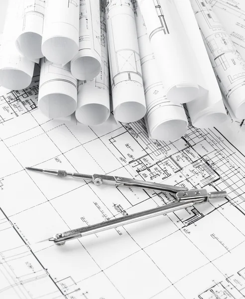 Rolls of architecture blueprints and house plans — Stock Photo, Image