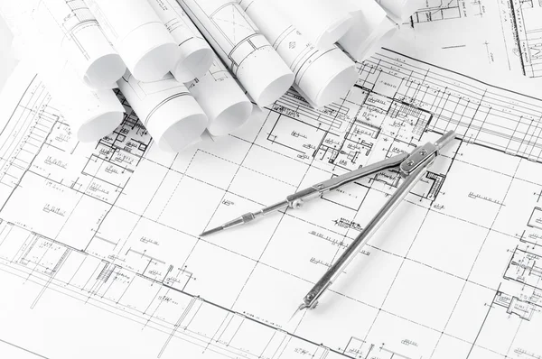 Rolls of architecture blueprints and house plans — Stock Photo, Image