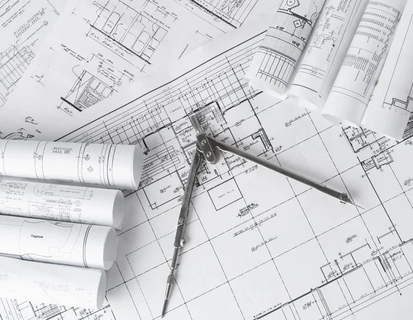 Rolls of architecture blueprints and house plans — Stock Photo, Image