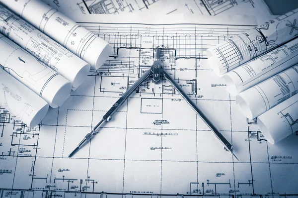 Rolls of architecture blueprints and house plans — Stock Photo, Image