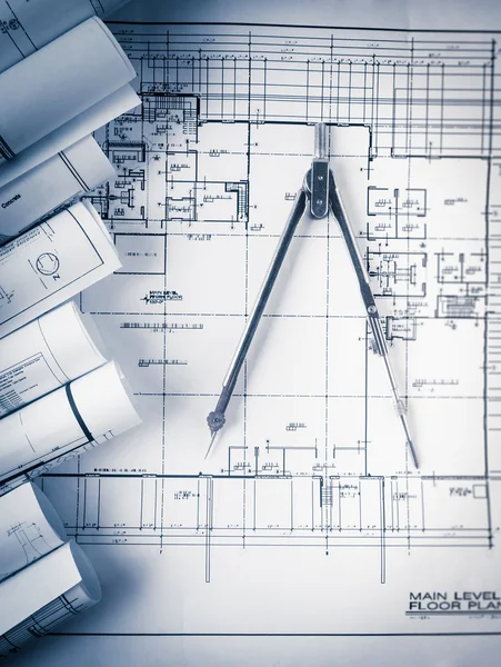 Rolls of architecture blueprints and house plans — Stock Photo, Image