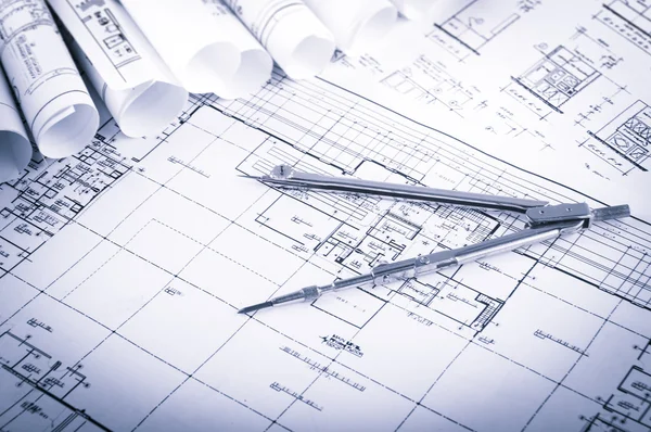 Rolls of architecture blueprints and house plans — Stock Photo, Image