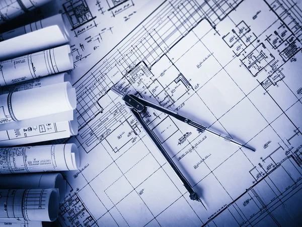 Rolls of architecture blueprints and house plans — Stock Photo, Image