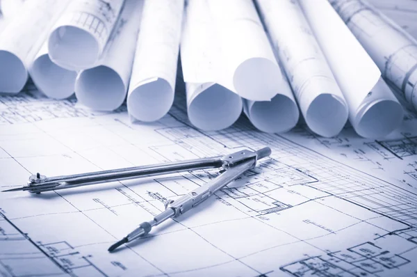 Rolls of architecture blueprints and house plans — Stock Photo, Image