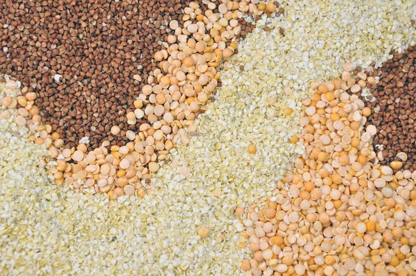 Buckwheat, peas and millet flakes. — Stock Photo, Image