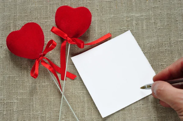 Hearts and a note. — Stock Photo, Image