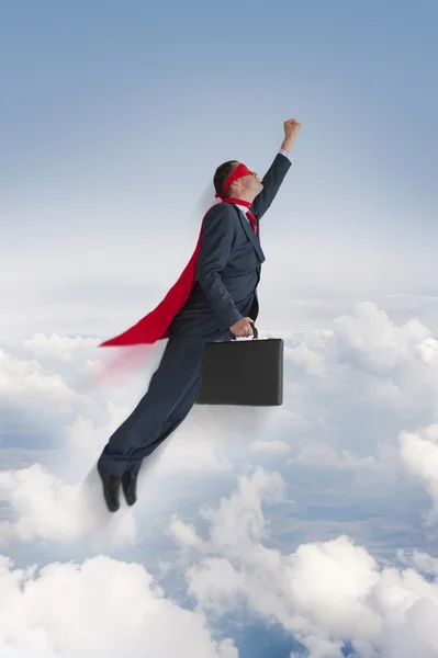 Superhero businessman flying upwards — Stock Photo, Image