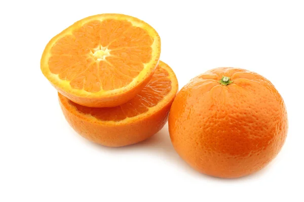 Fresh tangerine and a cut one — Stock Photo, Image