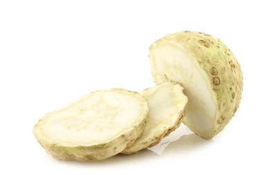 fresh celery root cut in slices clipart