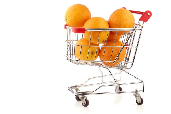 Fresh oranges in a shopping cart — Stock Photo, Image