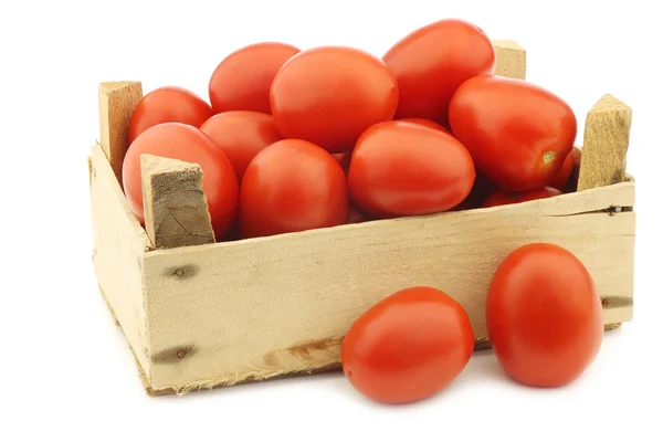 Fresh and colorful italian roma tomatoes in a wooden crate — Stock Photo, Image