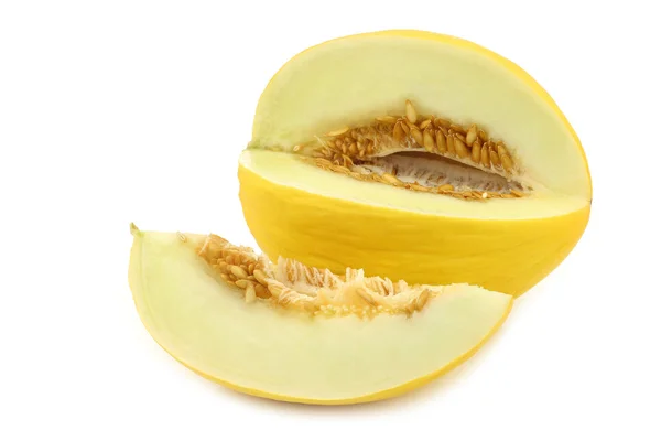 Fresh yellow honey melon and a cut piece — Stock Photo, Image