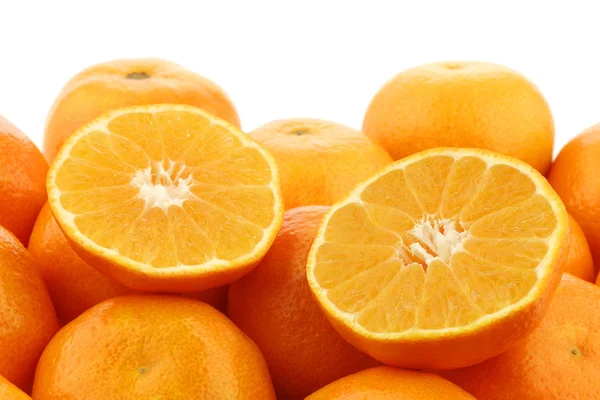 Bunch of fresh tangerines and a cut one — Stock Photo, Image