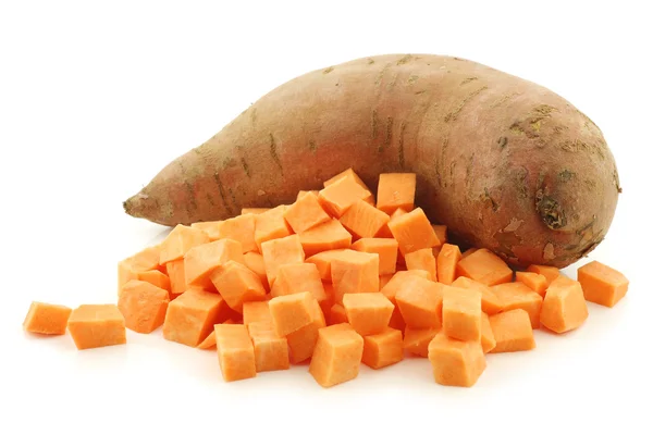 One whole sweet potato and cut pieces — Stock Photo, Image