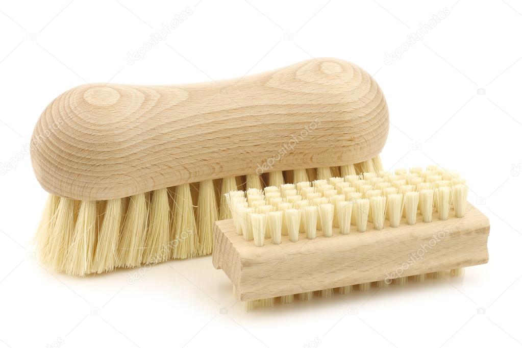A wooden nail brush and a wooden household brush